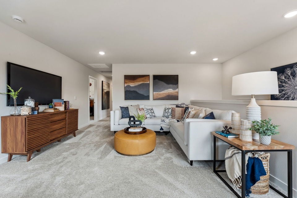 A living room with a couch and a coffee table.