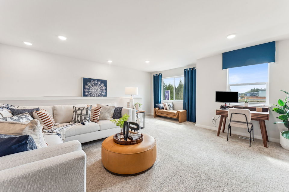 A living room with a large window.