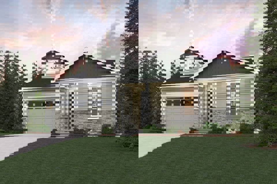 A house with a lawn in front of it.