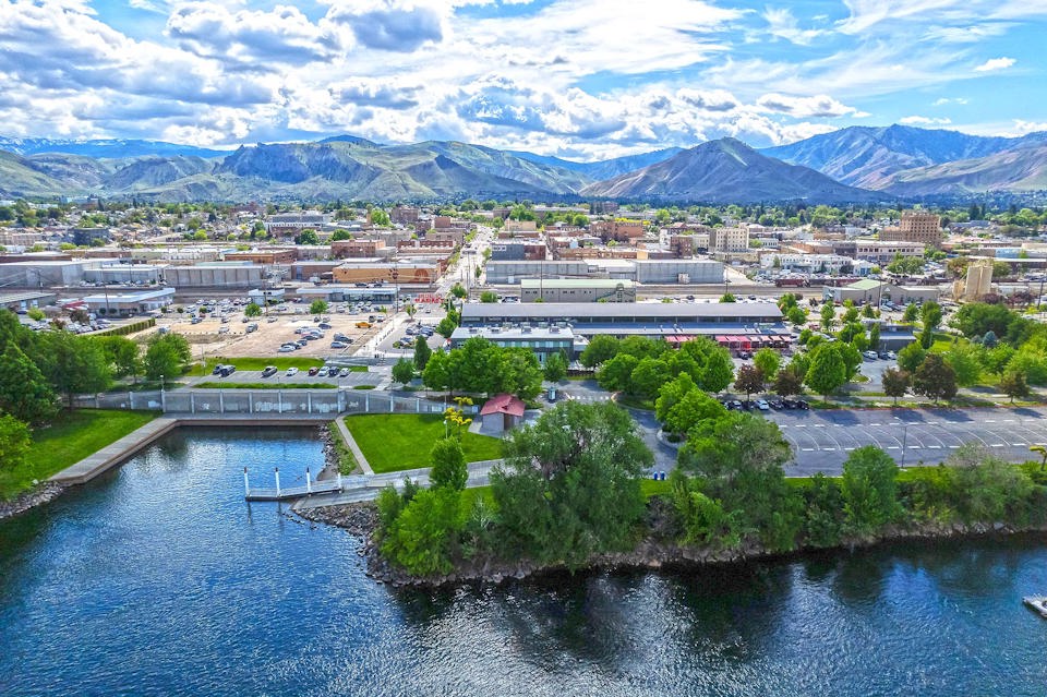 A river with a city in the background.