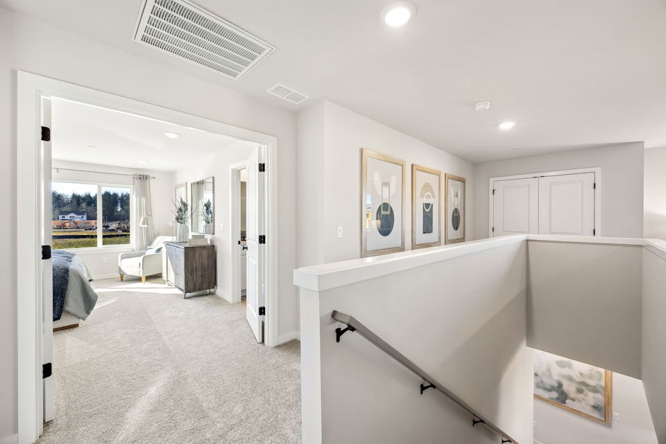 A room with white walls and a white counter with a white cabinet.