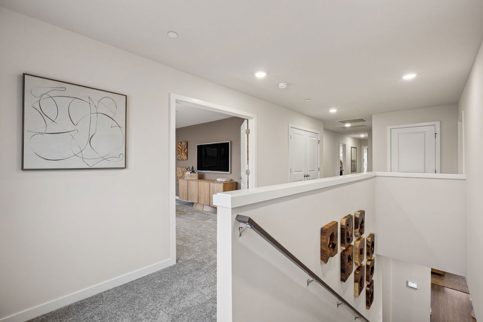 A white room with a staircase.