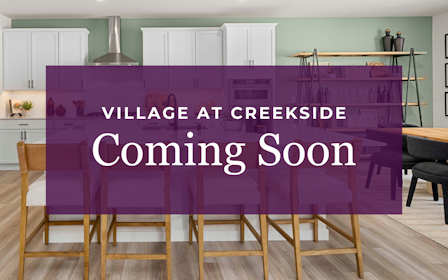 A purple table with chairs and a purple wall with white text.