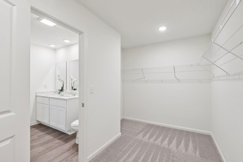 A bathroom with a white shower.