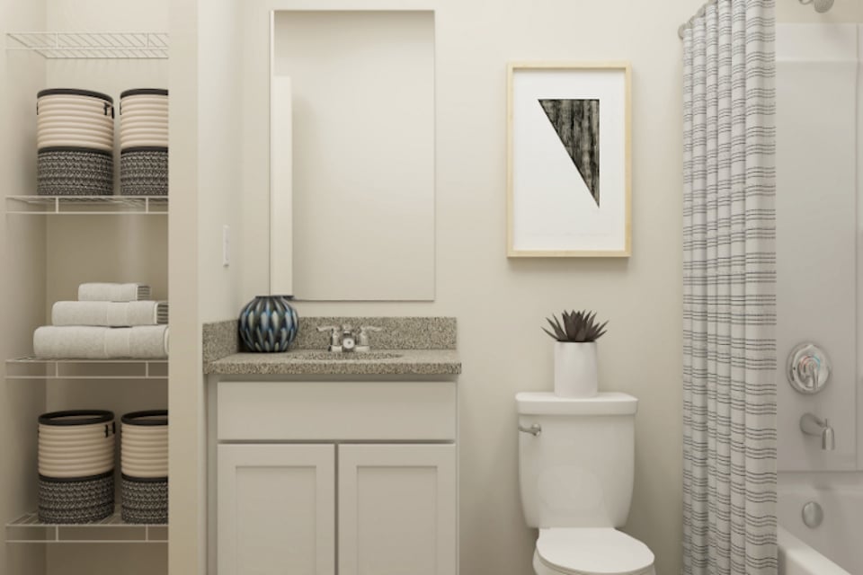 A bathroom with a toilet and a sink.