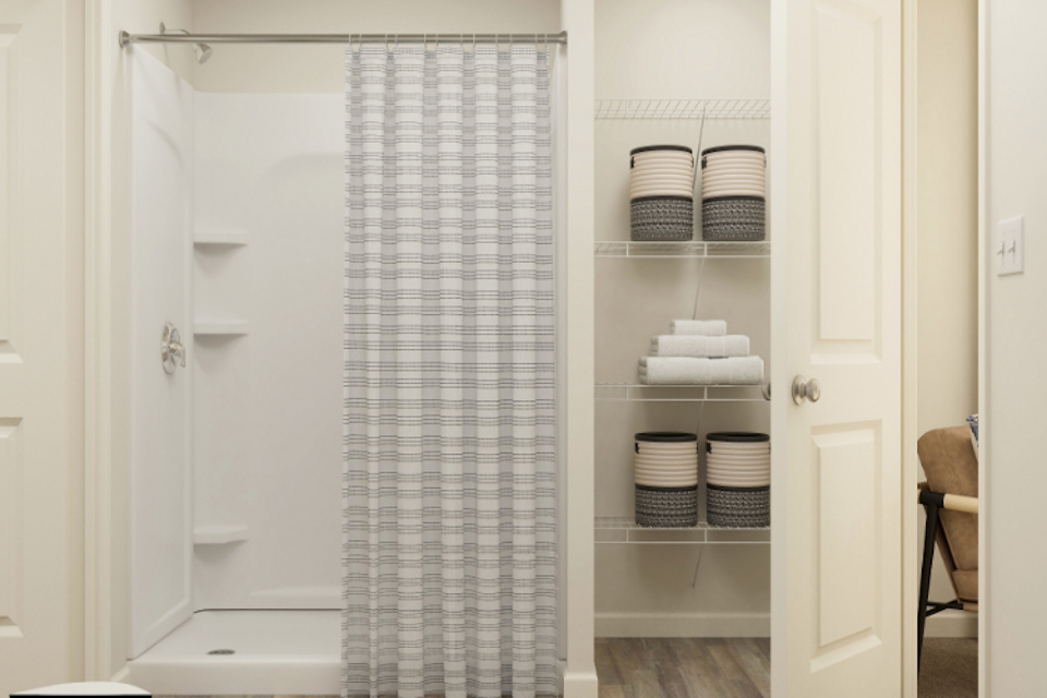 A shower with a glass door.