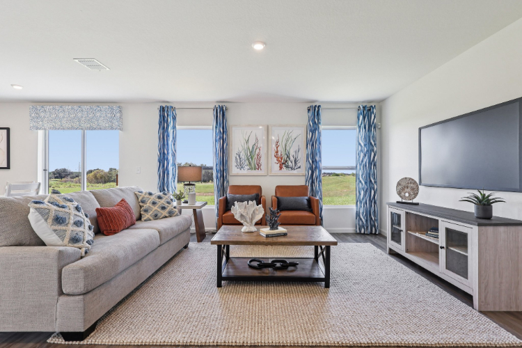 A living room with a tv and couches.