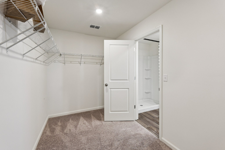 A hallway with white doors.
