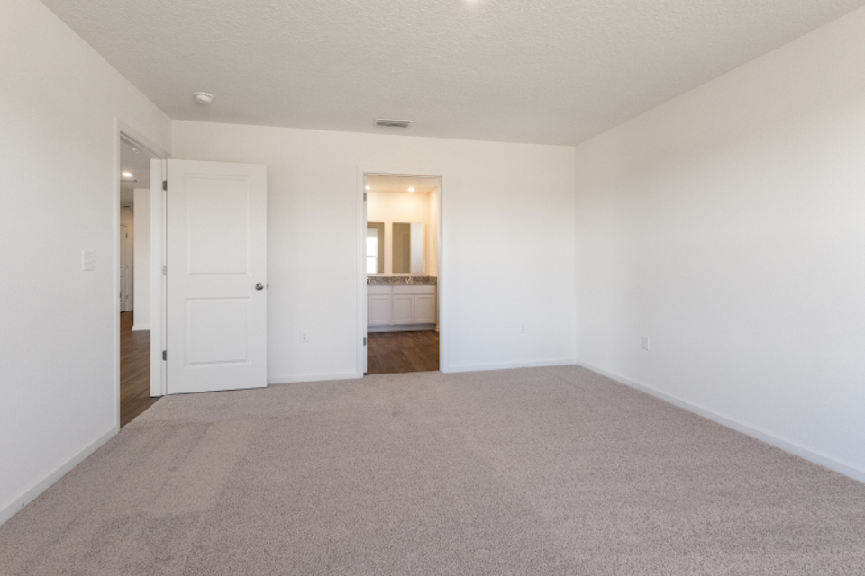 A hallway with white doors.