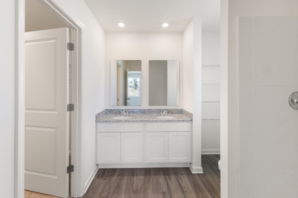 A bathroom with white walls.