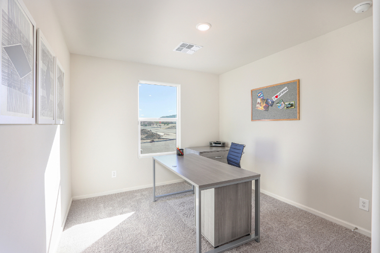 A room with a table and a chair.