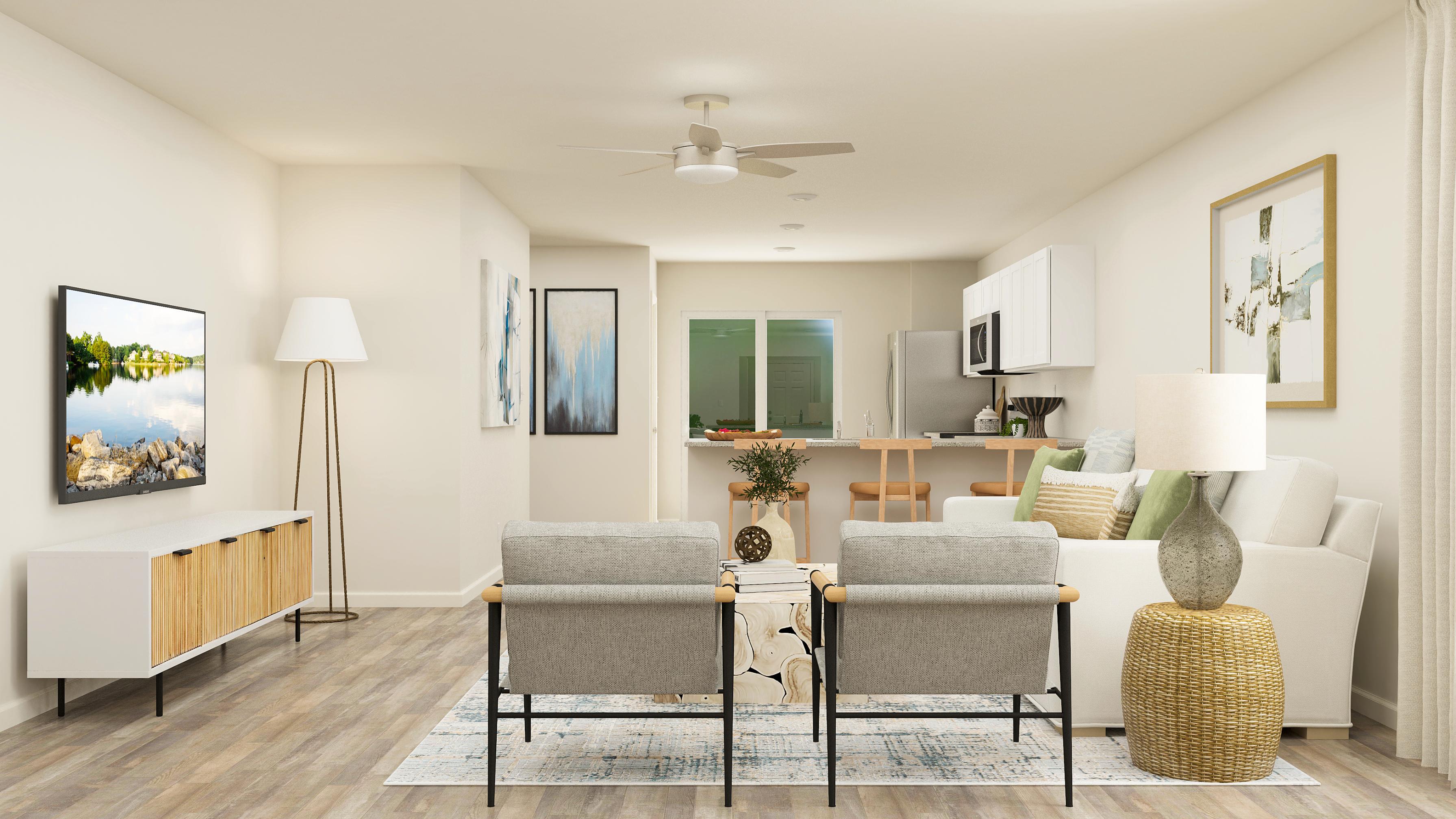A living room with a white couch and a table.