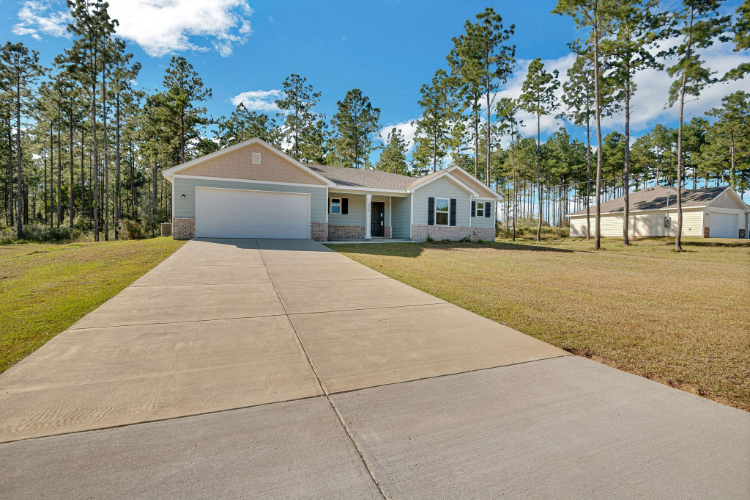 A walkway leading to a house.