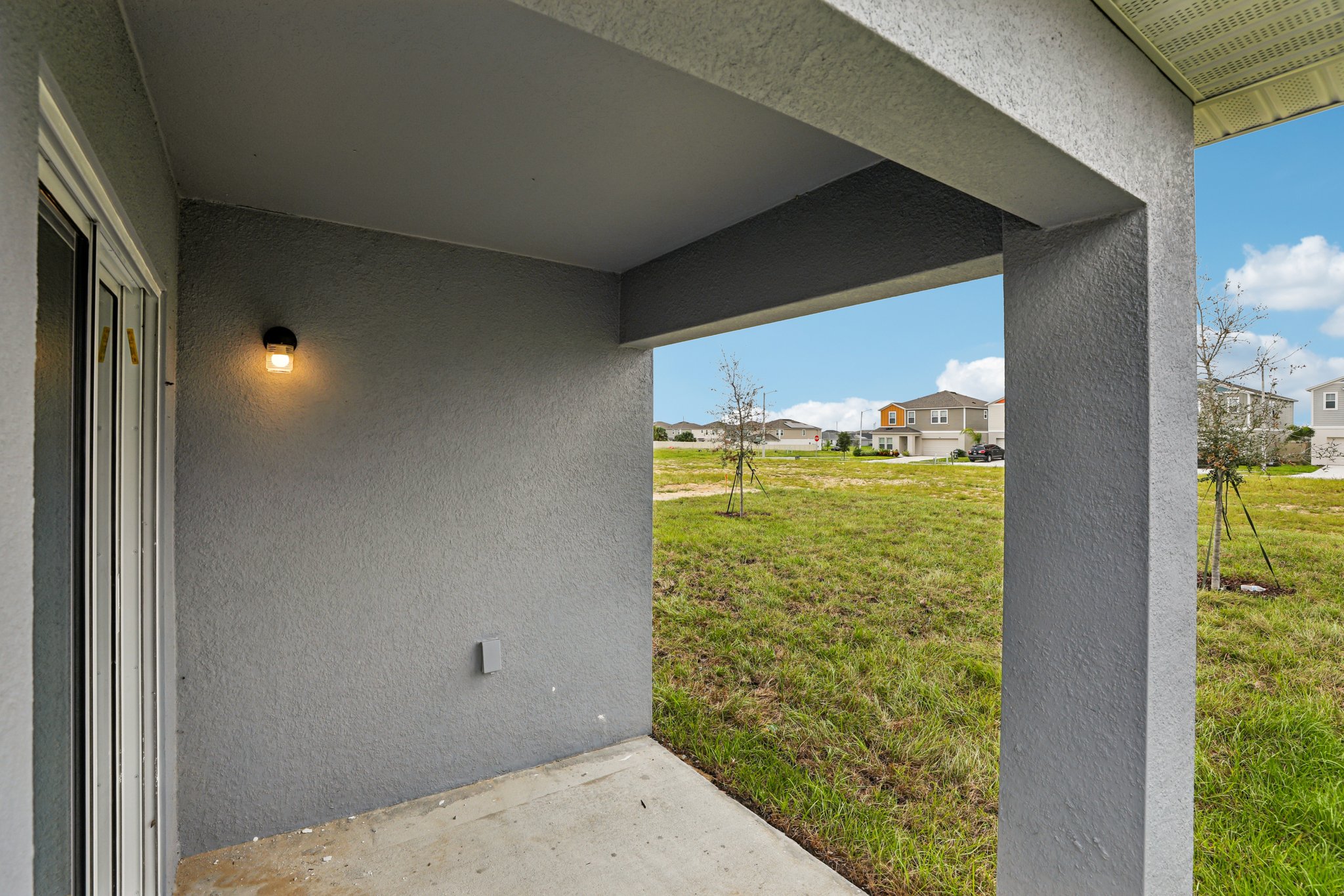 A building with grass and a walkway.