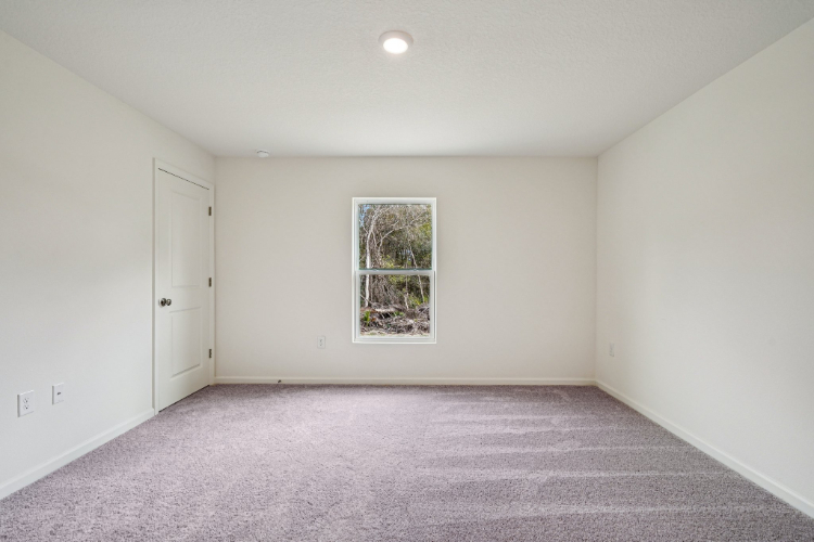 A room with a window and a door.