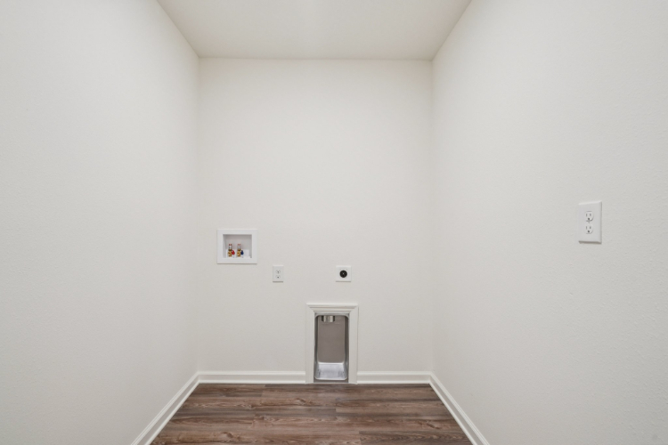 A room with a wood floor and a wood floor.