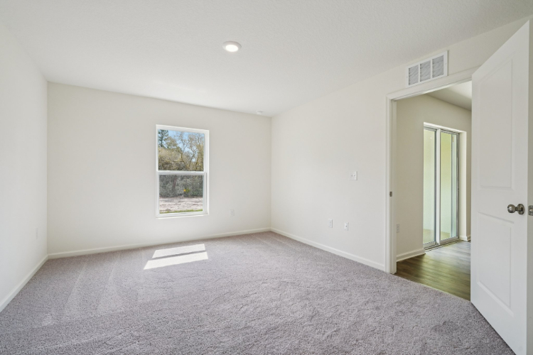 A hallway with white walls.