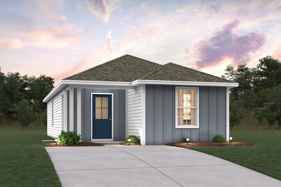 A white house with a driveway.