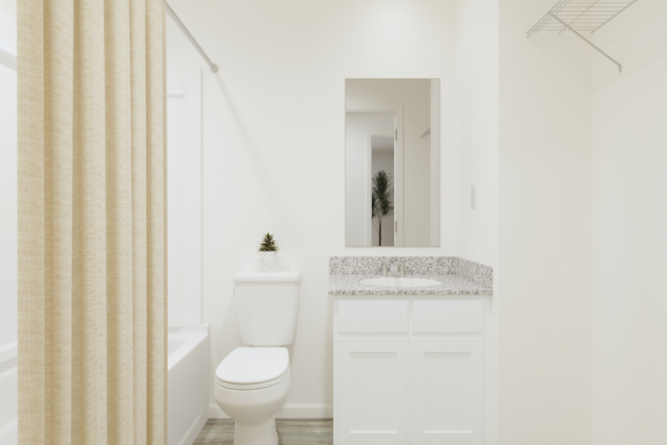 A bathroom with a sink toilet and a bathtub.