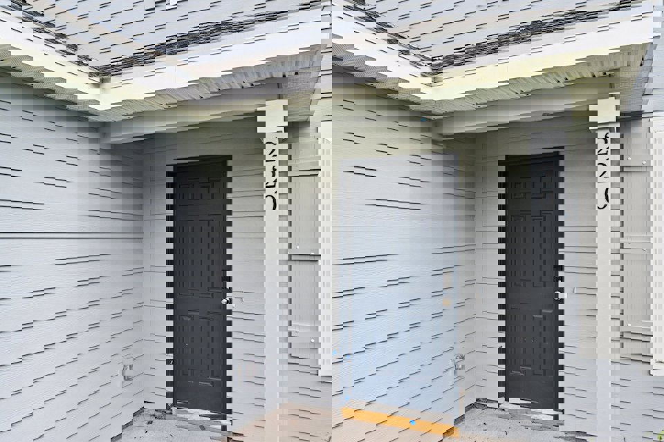 A white house with a blue door.