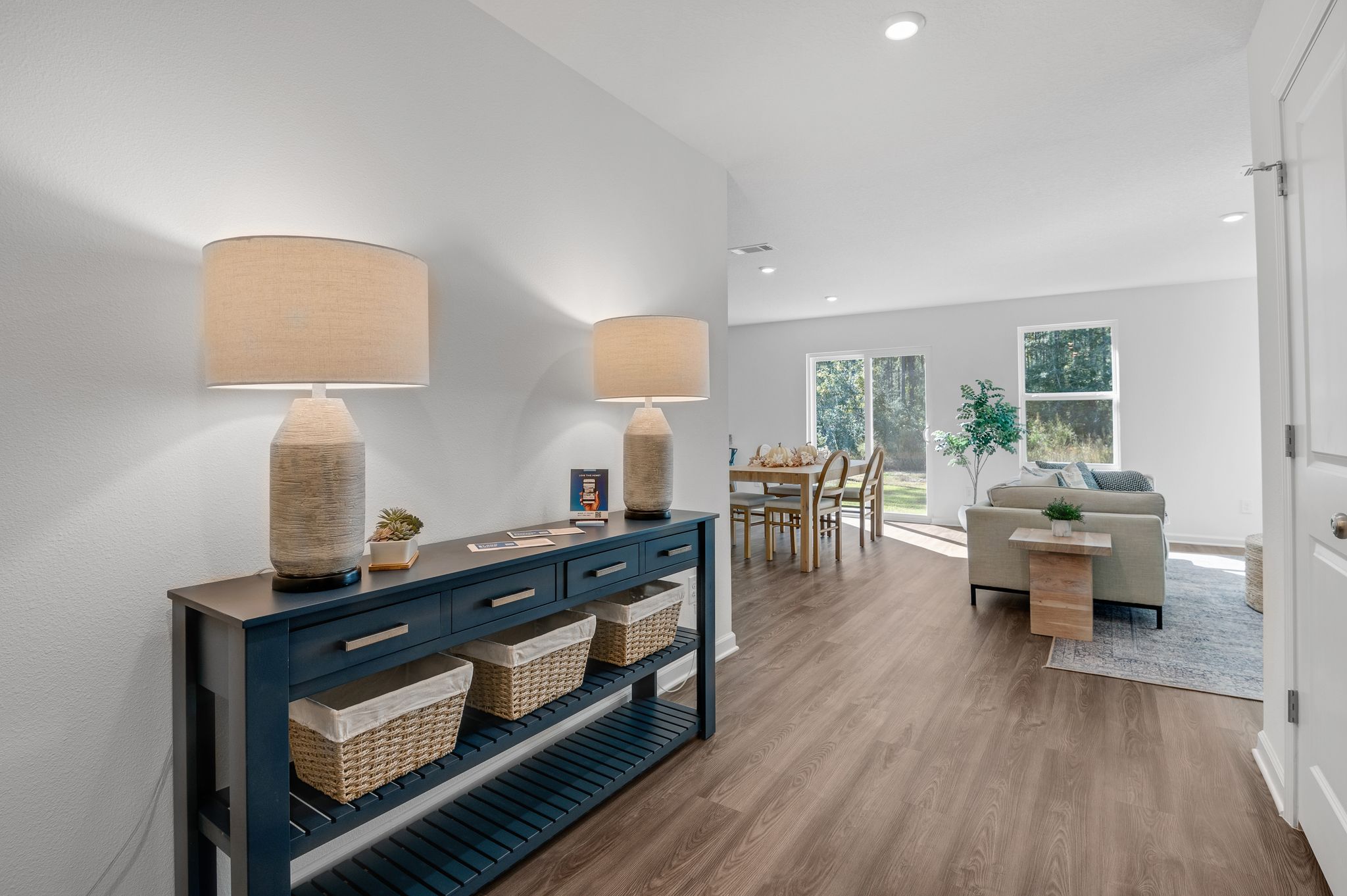 A living room with a wood floor.