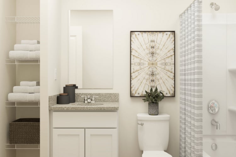 A bathroom with a toilet and a sink.