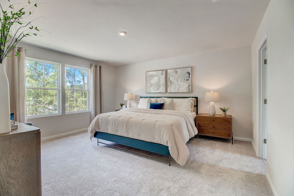 A bedroom with a large bed.