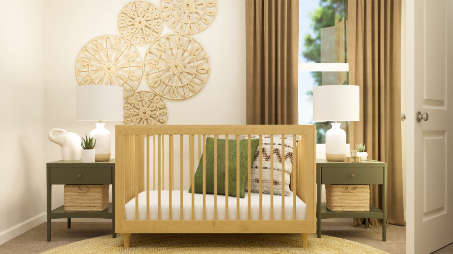 A white bed with a green pillow.