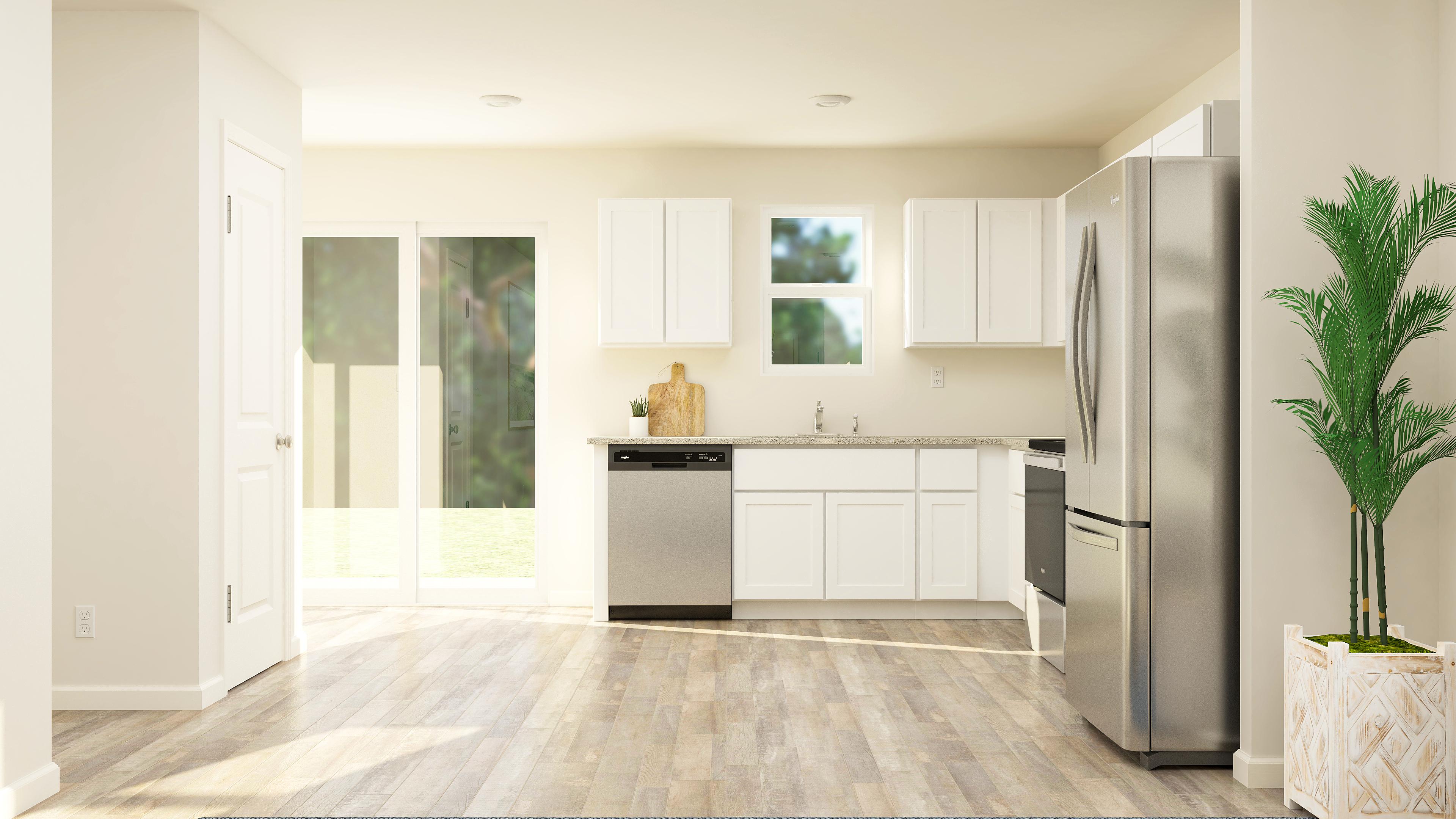 A kitchen with white cabinets.